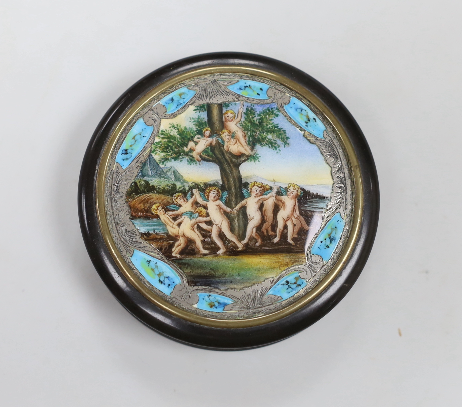 A 19th century circular tortoiseshell box, with ornate enamel and white metal cover, 8cm diameter